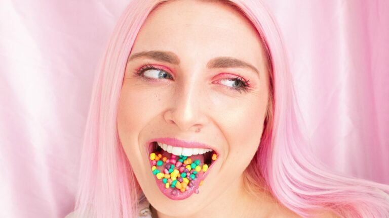 Woman with sugar on her tongue