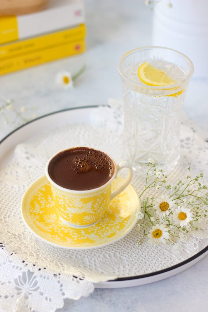 coffee and glass of water with lemon