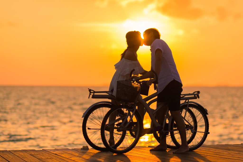 Kissing Virgo man sunset bicycles